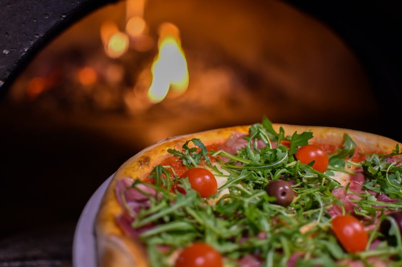 Green Lantern Pizza kitchen — handcrafting pizza dough in Toledo OH