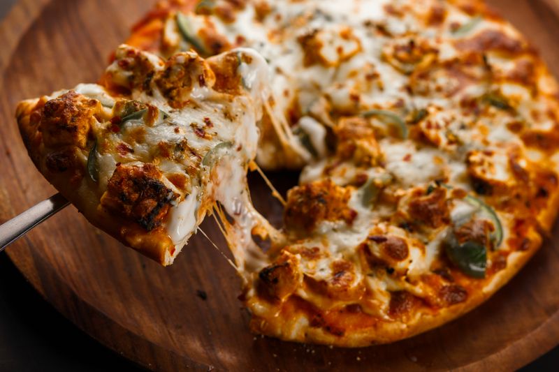 Four Cheese pizza with mozzarella, cheddar, gouda, parmesan